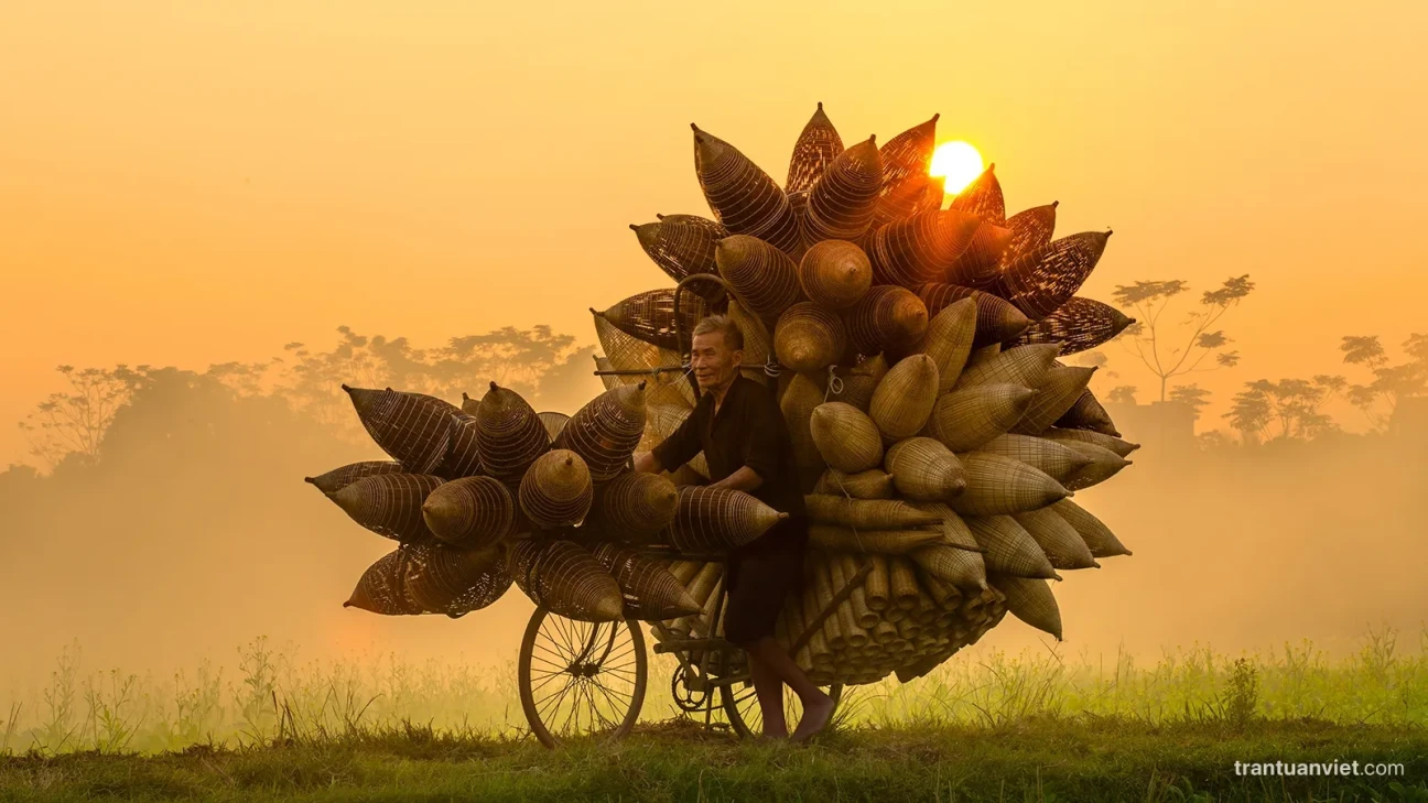 Elderly farmer in bamboo fishing trap village