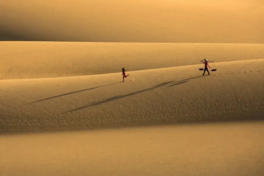 Mother and daughter on sanddune, VN015